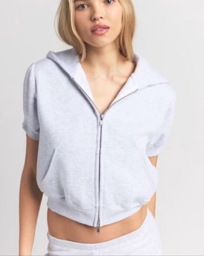 Sudadera recortada con cremallera y mangas abullonadas para mujeres